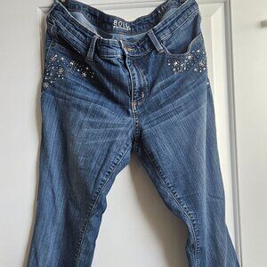 Bold Elements, women jeans, blue with rimstones accent on the front pockets.